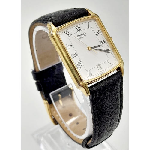 748 - A gold plated SEIKO watch. Case 27 x 25 mm, white dial with Roman numerals, Japanese quartz movement... 