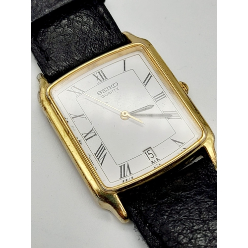 748 - A gold plated SEIKO watch. Case 27 x 25 mm, white dial with Roman numerals, Japanese quartz movement... 