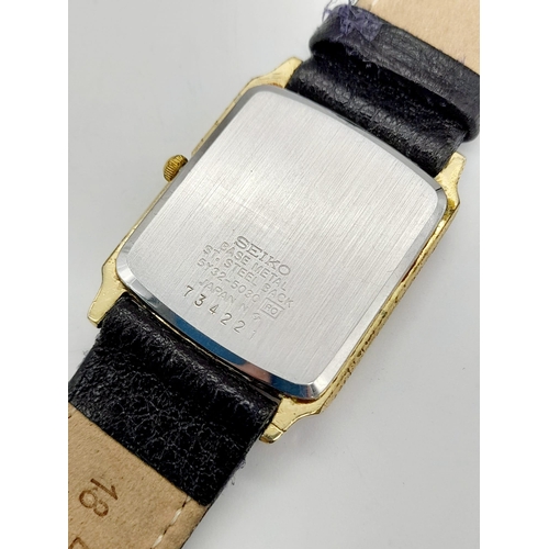 748 - A gold plated SEIKO watch. Case 27 x 25 mm, white dial with Roman numerals, Japanese quartz movement... 