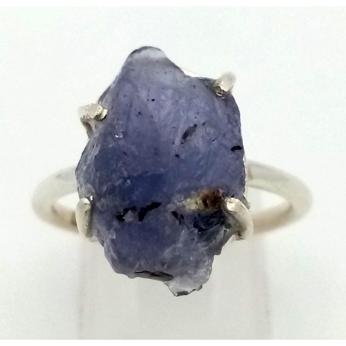 859 - A Natural Earth Mined Rough Amethyst Silver Ring. 925 Sterling silver. 4.25g. Size Q 1/2. Comes in a... 