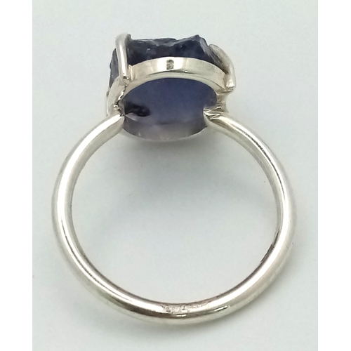 859 - A Natural Earth Mined Rough Amethyst Silver Ring. 925 Sterling silver. 4.25g. Size Q 1/2. Comes in a... 