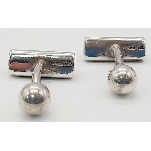 1065 - A Pair of 925 Silver and Onyx Cufflinks. Total Weight 7.59grams