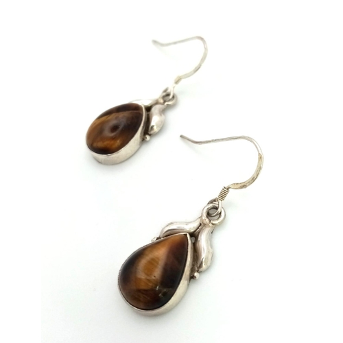 1283 - A Pair of Tiger Eye Gemstone Round Cut Earrings. 925 Sterling silver. Comes in a presentation case.