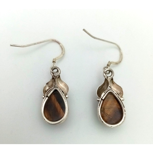 1283 - A Pair of Tiger Eye Gemstone Round Cut Earrings. 925 Sterling silver. Comes in a presentation case.