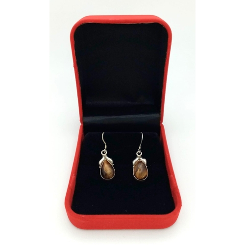 1283 - A Pair of Tiger Eye Gemstone Round Cut Earrings. 925 Sterling silver. Comes in a presentation case.