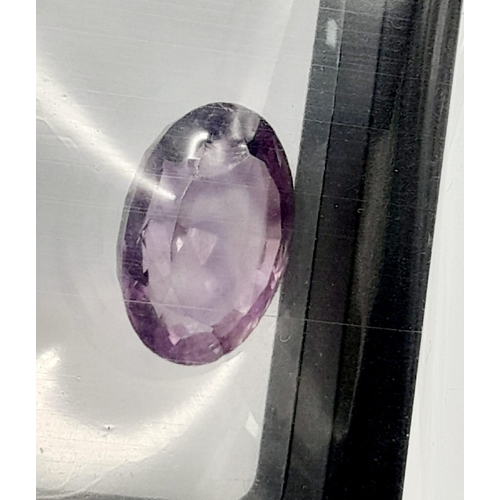 1306 - A 26.74ct Natural Oval Amethyst. AIG Milan Certified. Eye-clean clarity - Sealed Pack.