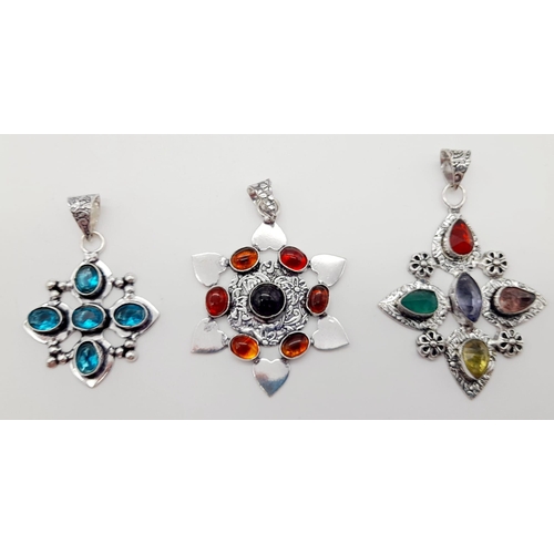 1379 - Three Different Coloured Gemstone Pendants set in White Metal. 6cm - largest pendant.