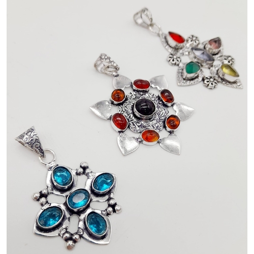 1379 - Three Different Coloured Gemstone Pendants set in White Metal. 6cm - largest pendant.