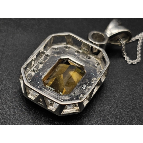 153 - A very nice 18 K white gold pendant with an emerald cut citrine surrounded by diamonds (3 ct. appr.)... 