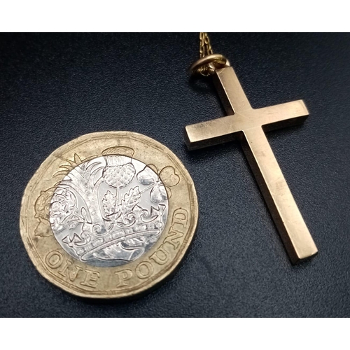 203 - An 18 K yellow gold cross with chain. Cross dimensions: 33 x 18 x 3 mm, chain length: 50 cm, total w... 