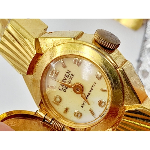 301 - A vintage, richly gilded, CARVEN DELUXE Antimagnetic, ladies, bangle watch with a large, synthetic, ... 