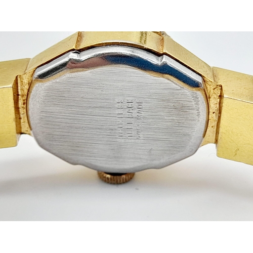 301 - A vintage, richly gilded, CARVEN DELUXE Antimagnetic, ladies, bangle watch with a large, synthetic, ... 