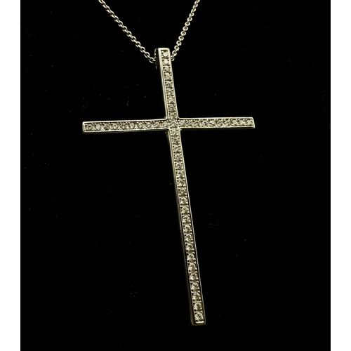 393 - An 18K White Gold Diamond Cross Pendant on an 18K White Gold Necklace. 2ctw diamonds approx. 10.63g ... 