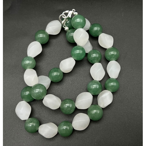 443 - A Green Aventurine and Frosted White Chalcedony Necklace. Aventurine-12mm. Chalcedony-14mm. 44cm nec... 