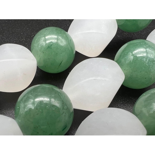 443 - A Green Aventurine and Frosted White Chalcedony Necklace. Aventurine-12mm. Chalcedony-14mm. 44cm nec... 