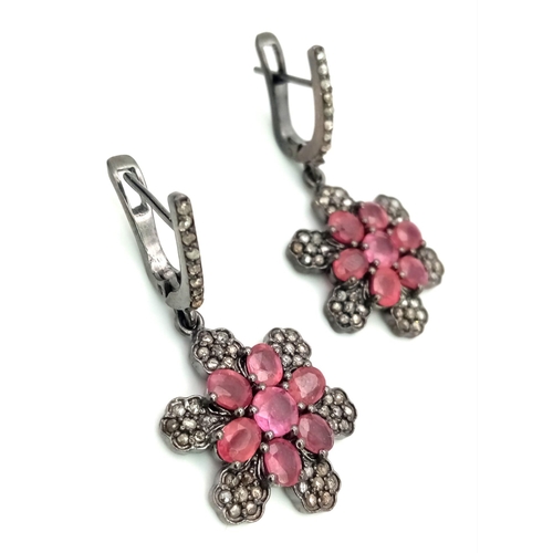 465 - A Pair of Ruby and Diamond Drop Earrings set in 925 Silver. Black Antique Finish. Comes in a present... 