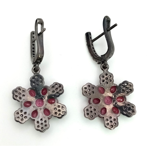 465 - A Pair of Ruby and Diamond Drop Earrings set in 925 Silver. Black Antique Finish. Comes in a present... 