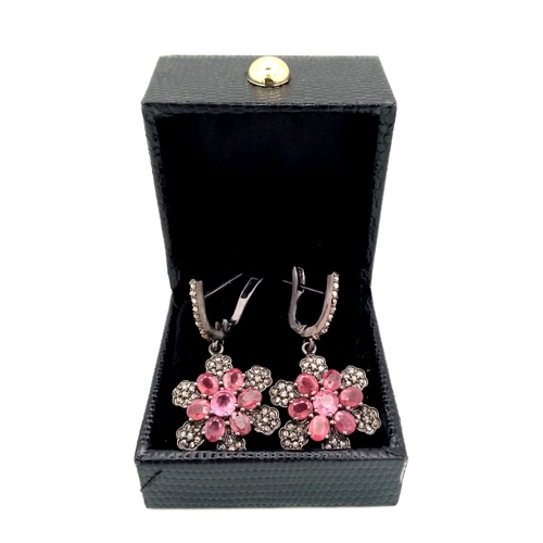 465 - A Pair of Ruby and Diamond Drop Earrings set in 925 Silver. Black Antique Finish. Comes in a present... 