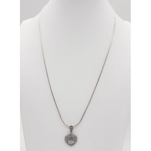 466 - A 925 Silver Necklace with a 925 Silver White Stone Heart Pendant. 22cm and 3cm.