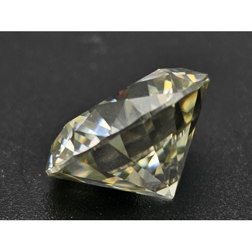 493 - A 14.250ct Round Brilliant Cut Tinted White Moissanite. GLI certified.