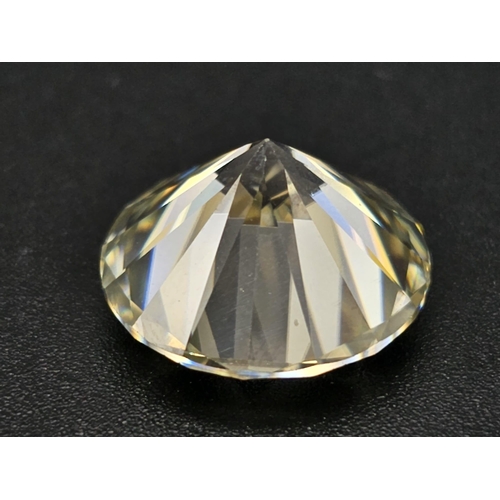 493 - A 14.250ct Round Brilliant Cut Tinted White Moissanite. GLI certified.