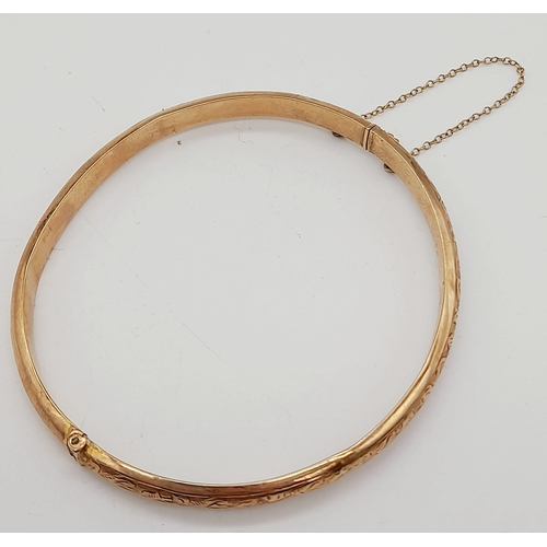 51 - A Vintage 9K Yellow Gold Bangle. Full UK hallmarks. Clip opening. 6cm inner diameter. 6.12g