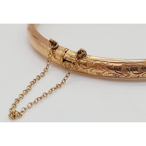 51 - A Vintage 9K Yellow Gold Bangle. Full UK hallmarks. Clip opening. 6cm inner diameter. 6.12g