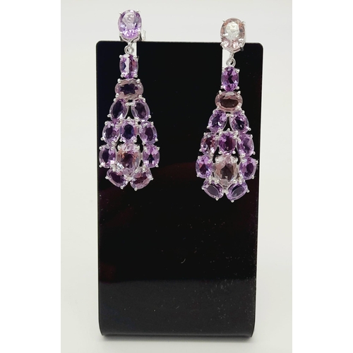 534 - A Pair of Amethyst Gemstone Dangler Earrings set in 925 Silver. 5cm.