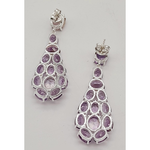 534 - A Pair of Amethyst Gemstone Dangler Earrings set in 925 Silver. 5cm.