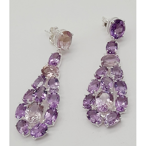 534 - A Pair of Amethyst Gemstone Dangler Earrings set in 925 Silver. 5cm.