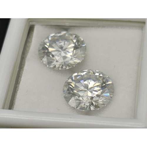 715 - A 5.40cts Round Brilliant Cut pair of White Moissanites. GLI certified.