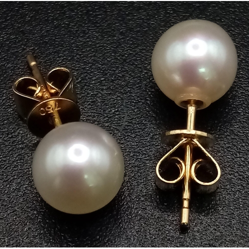 717 - A Pair of 18K Yellow Gold South Sea Pearl Stud Earrings. 1.3g total weight.