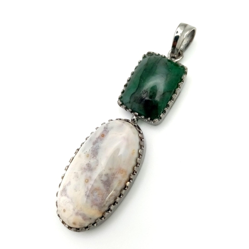 885 - A Green and White Agate Pendant. Set in 925 Sterling silver.  12.3g total weight. Comes in a present... 