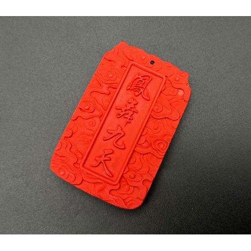 923 - A Red Chinese Cinnabar Dragon Pendant. 5.5 x 3.5cm