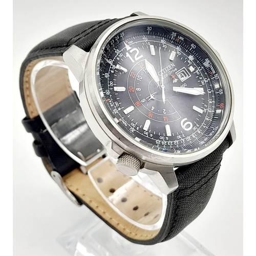 932 - A Citizen Eco-Drive Gents Watch. Black leather strap and steel case - 43mm. Black dial with date win... 