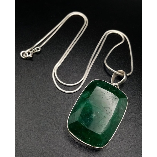 1038 - An Emerald Pendant with Matching Drop Earrings set in 925 Silver. Pendant comes on a 925 silver thin... 