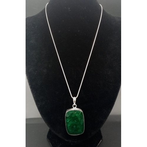 1038 - An Emerald Pendant with Matching Drop Earrings set in 925 Silver. Pendant comes on a 925 silver thin... 