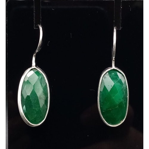 1038 - An Emerald Pendant with Matching Drop Earrings set in 925 Silver. Pendant comes on a 925 silver thin... 