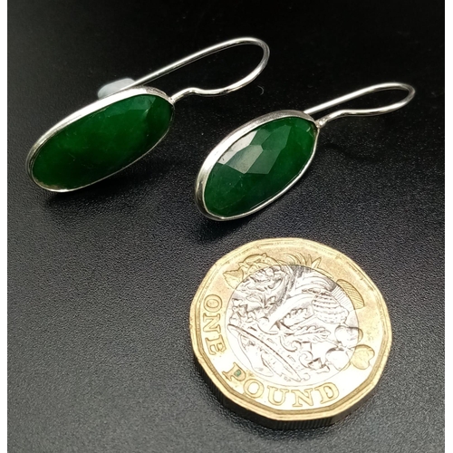 1038 - An Emerald Pendant with Matching Drop Earrings set in 925 Silver. Pendant comes on a 925 silver thin... 