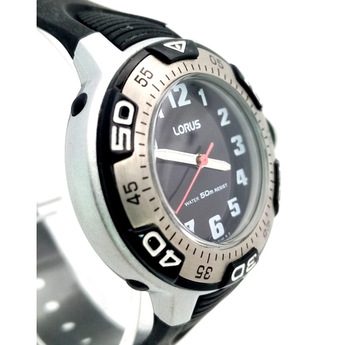 1148 - A stainless steel LORUS  watch. 33 mm case, calibrated bezel, black dial with white numerals and lum... 