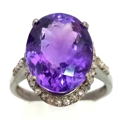 536 - An Amethyst Gemstone Ring with a Matching Pair of Stud Earrings. Both with Diamond Accents. All set ... 