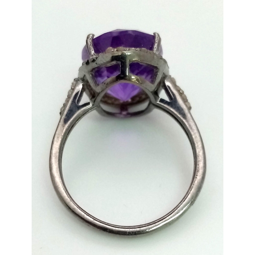 536 - An Amethyst Gemstone Ring with a Matching Pair of Stud Earrings. Both with Diamond Accents. All set ... 