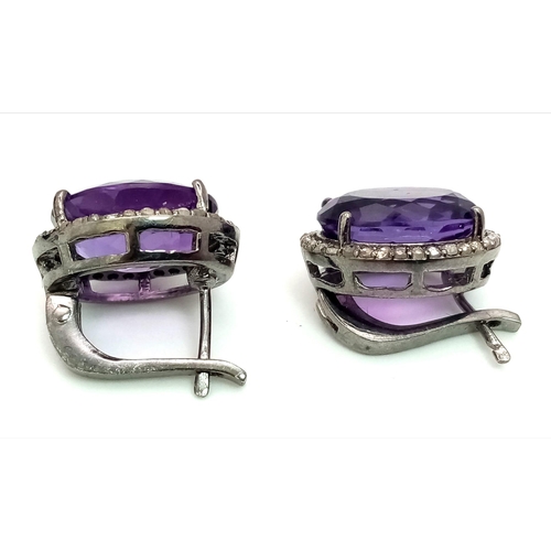 536 - An Amethyst Gemstone Ring with a Matching Pair of Stud Earrings. Both with Diamond Accents. All set ... 