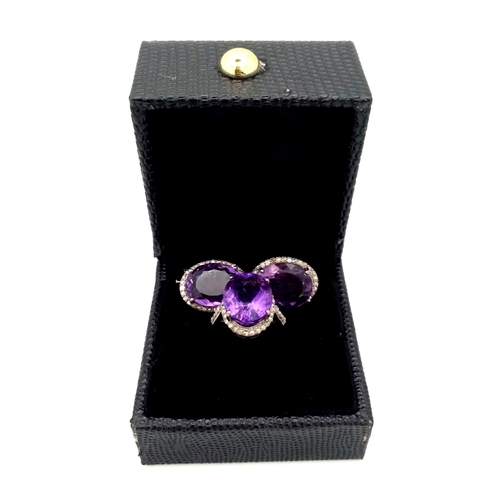 536 - An Amethyst Gemstone Ring with a Matching Pair of Stud Earrings. Both with Diamond Accents. All set ... 