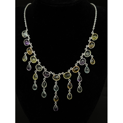 803 - A 925 Silver, Amethyst, Citrine and Garnet Gemstone Necklace. 46cm.