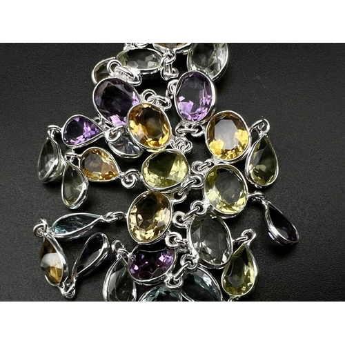 803 - A 925 Silver, Amethyst, Citrine and Garnet Gemstone Necklace. 46cm.