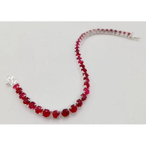 886 - A Ruby Gemstone Tennis Bracelet set in 925 Silver. 20cm.