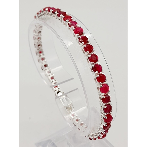 886 - A Ruby Gemstone Tennis Bracelet set in 925 Silver. 20cm.