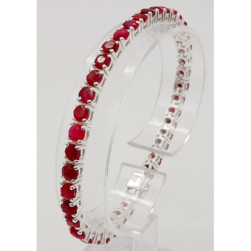 886 - A Ruby Gemstone Tennis Bracelet set in 925 Silver. 20cm.