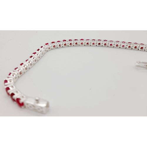 886 - A Ruby Gemstone Tennis Bracelet set in 925 Silver. 20cm.